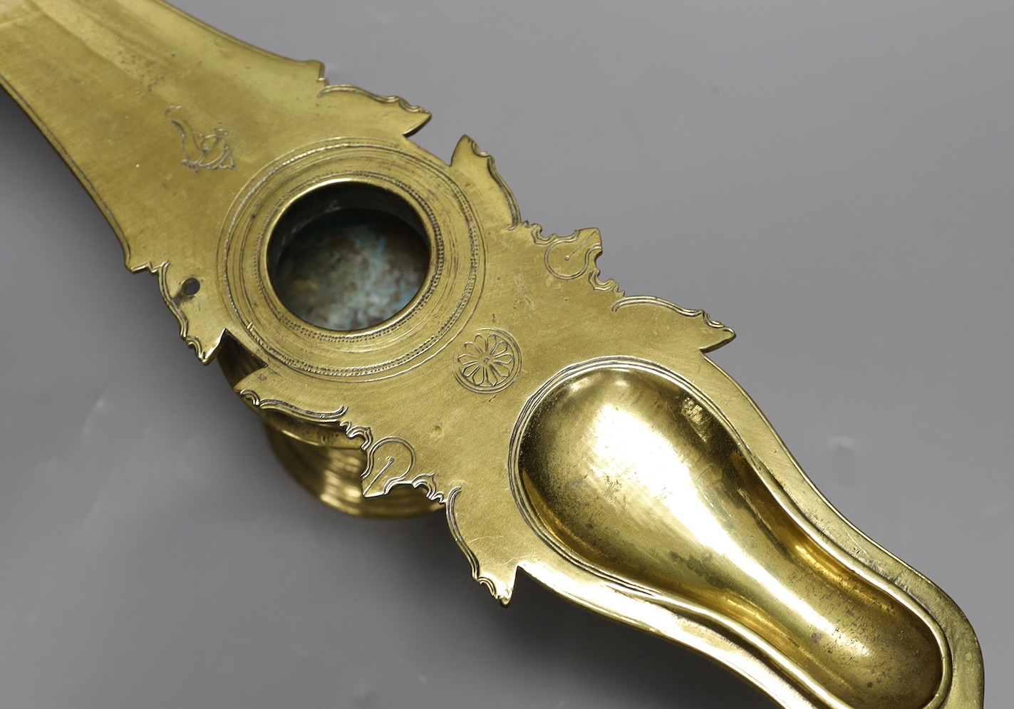 A 19th century Indian brass oil lamp, 45 cms wide